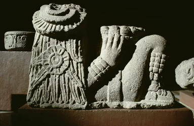 Recumbent sun god with a sun calendar disk in hair